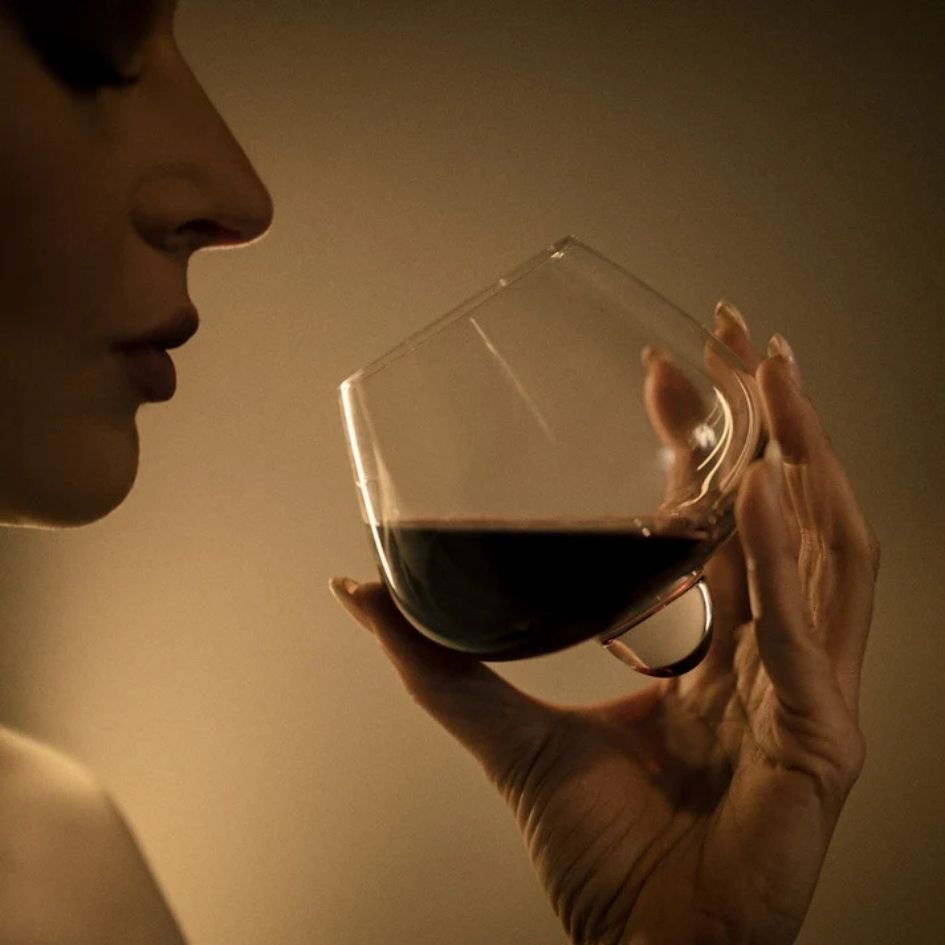 EQUILO No.2 wine glass held in hand with merlot