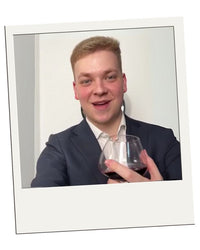 Polaroid-style customer review – EQUILO No.2 glass being held by Andy D.