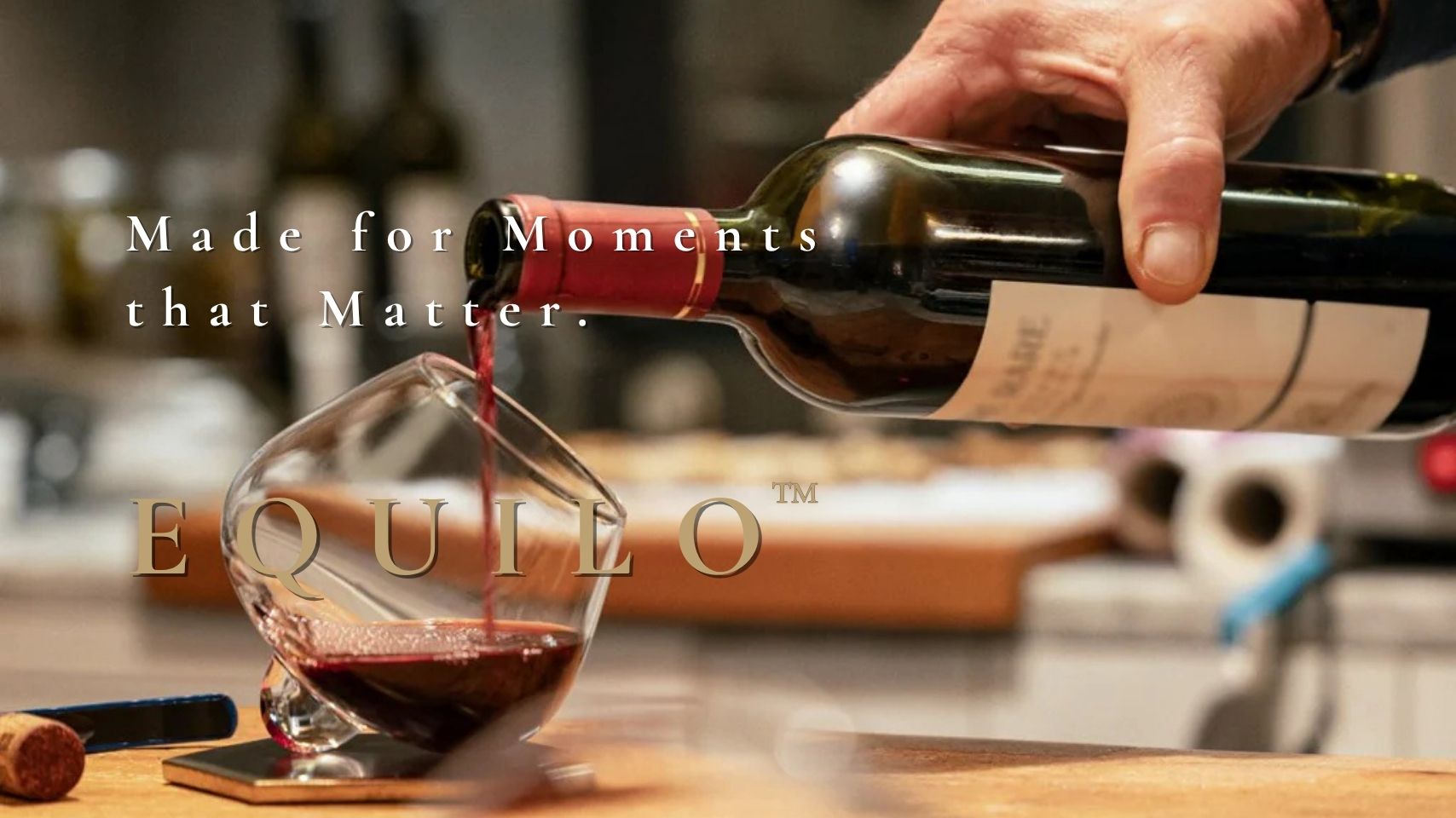 Red wine being poured into EQUILO No.2 glass – desktop hero