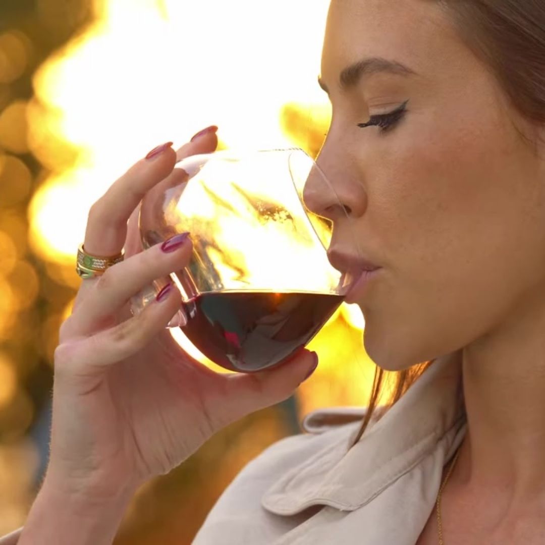 Woman sipping red wine from the hand-blown EQUILO No.2 glass — crafted for rich, full-bodied wines.