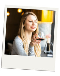 Polaroid-style customer review – EQUILO No.2 glass being held by Erin A.