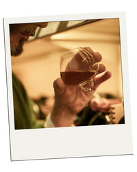Polaroid-style customer review – EQUILO No.1 glass being held to drink by Jack