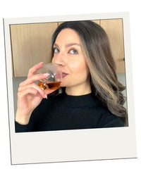 Polaroid-style customer review – EQUILO No.1 glass being held to drink by Julie A.