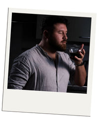 Polaroid-style customer review – EQUILO No.2 glass being held by Martin